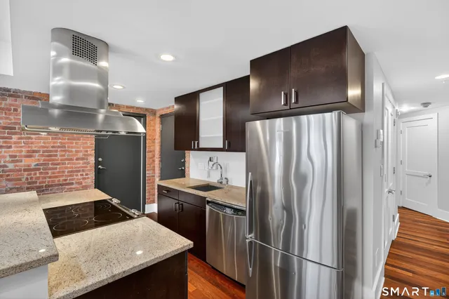 a bedroom with a bed and glass windows