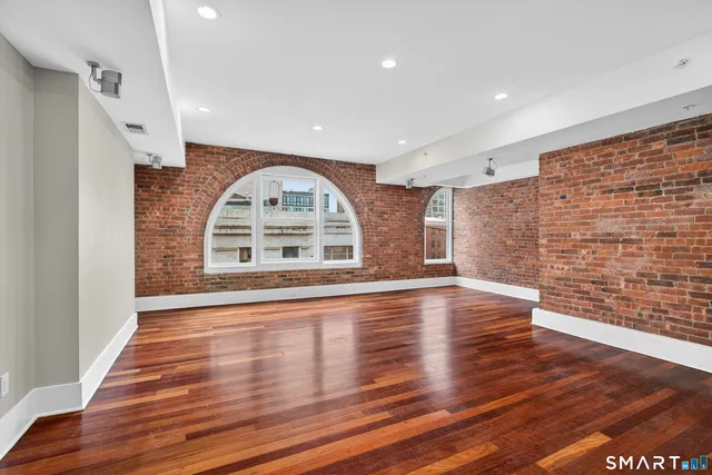 a view of a livingroom with furniture and wooden floor
