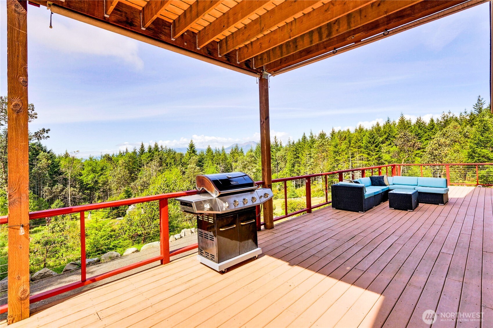 83 Octopus Court Quilcene, WA 98376 - Photo 8 of 40 a view of a balcony with chairs and wooden floor
