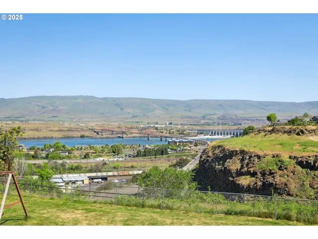 an aerial view of residential building and ocean