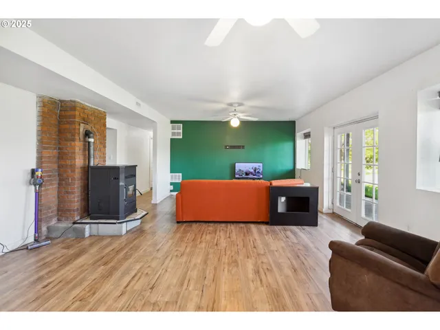 a living room with furniture window and wooden floor