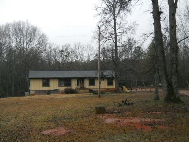 3001 Davis Academy Road Rutledge, GA 30663 - Photo 1 of 1 a front view of house with yard and trees around