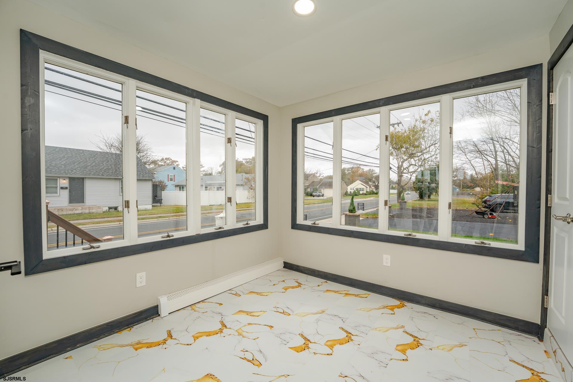 1203 West Mill Road Northfield, NJ 08225 - Photo 11 of 90 a view of a room with a large window