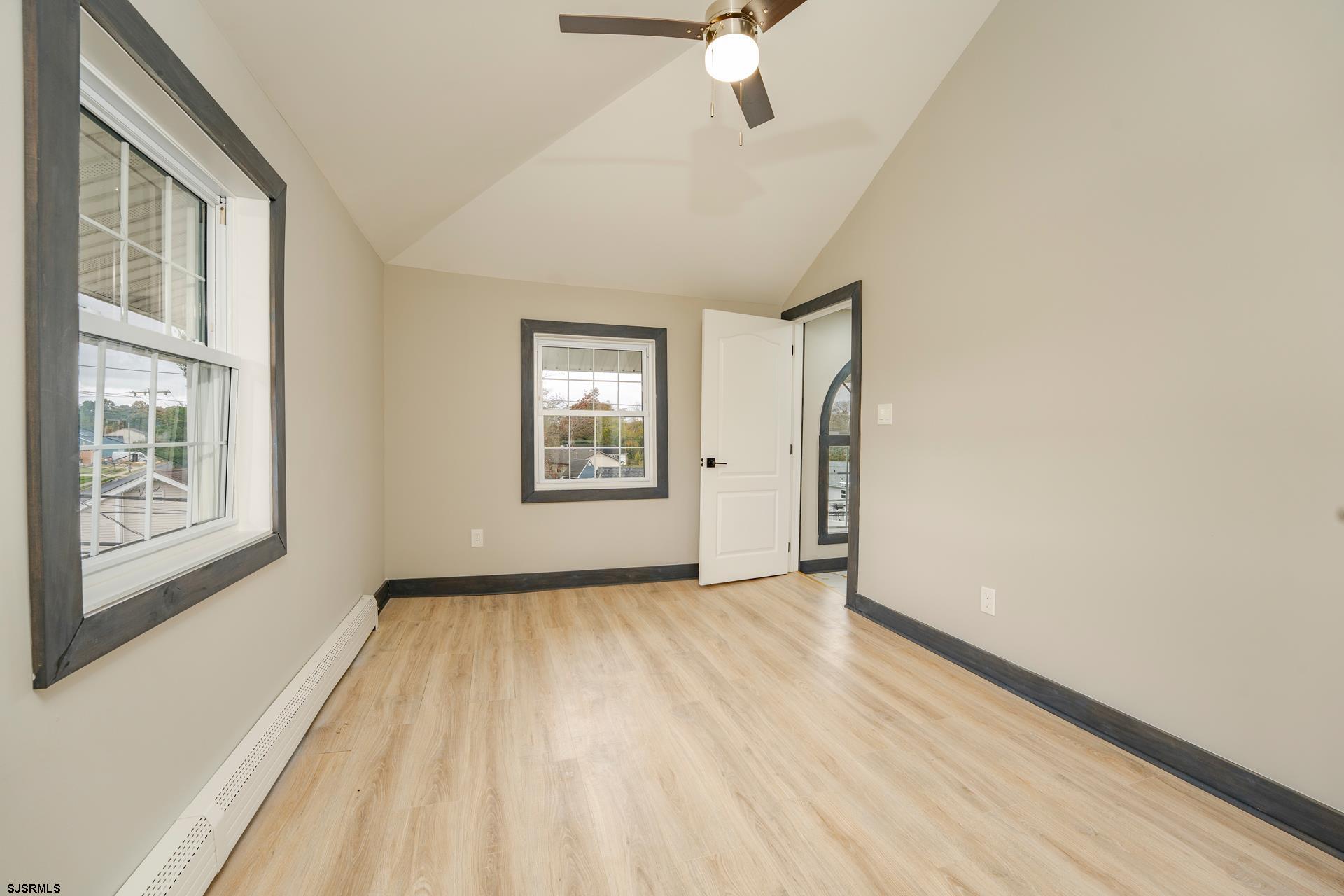 1203 West Mill Road Northfield, NJ 08225 - Photo 29 of 90 wooden floor in an empty room with a window