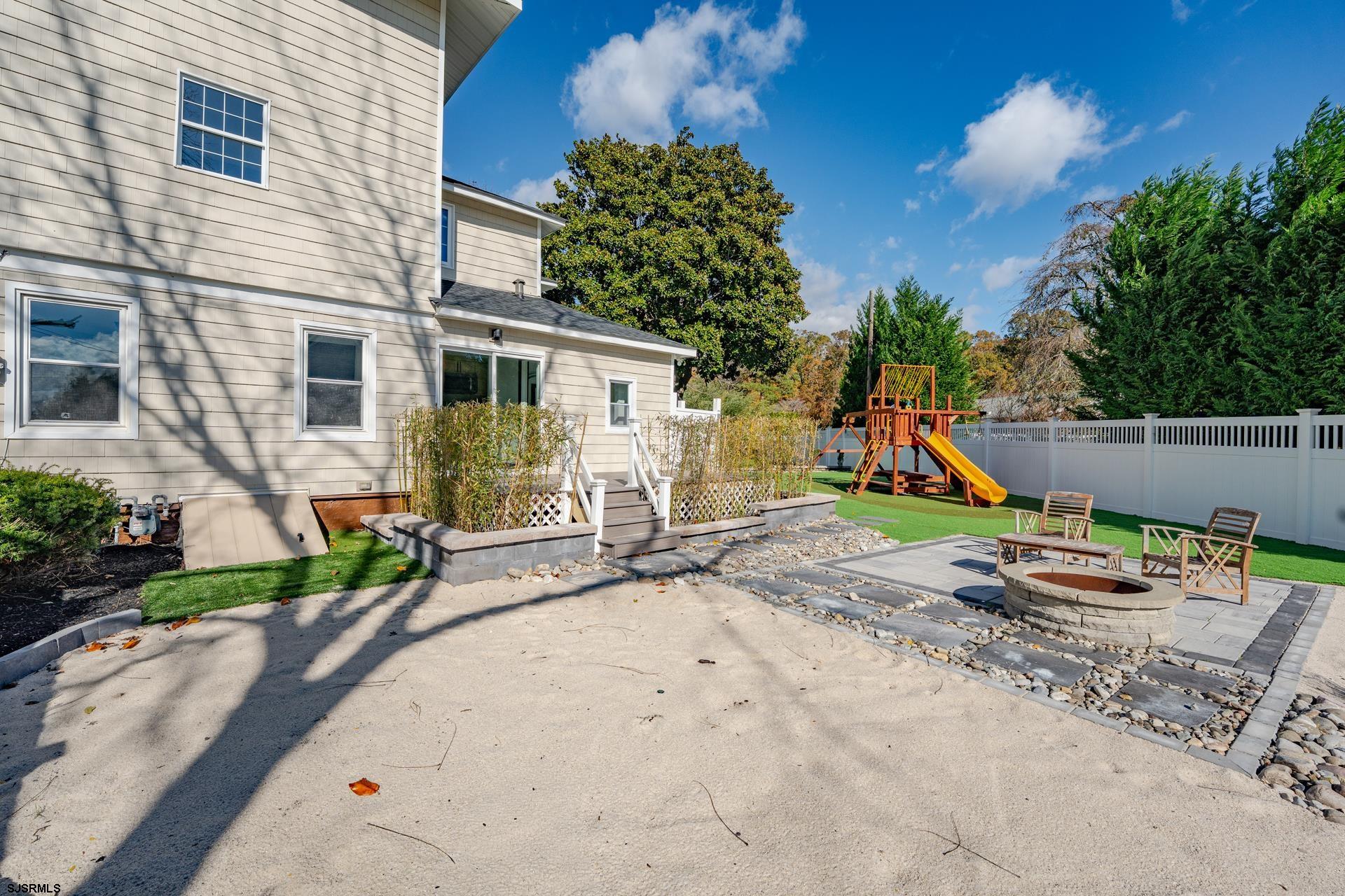 1203 West Mill Road Northfield, NJ 08225 - Photo 30 of 90 a view of a house with backyard and sitting area