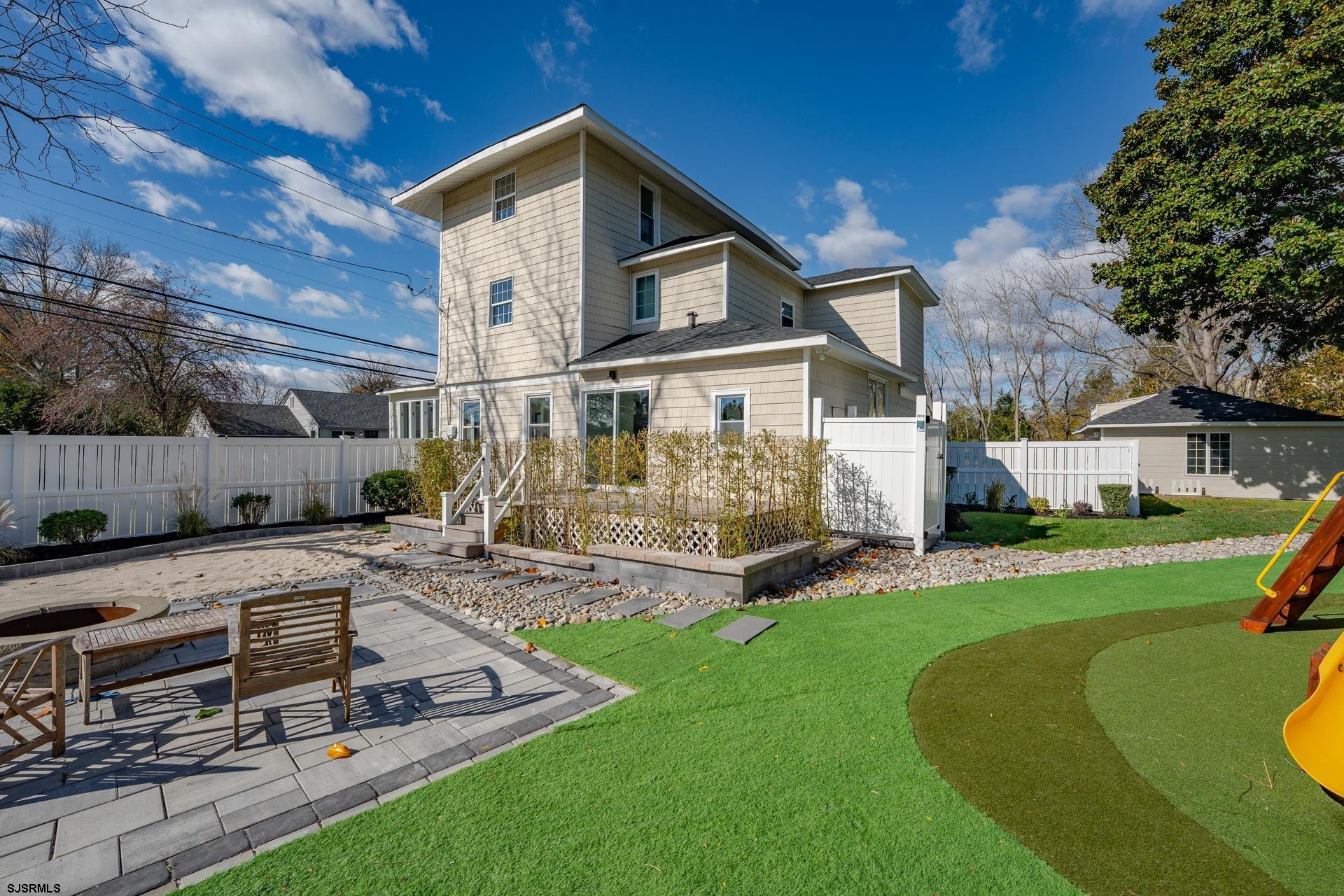 1203 West Mill Road Northfield, NJ 08225 - Photo 33 of 90 a view of a house with a swimming pool