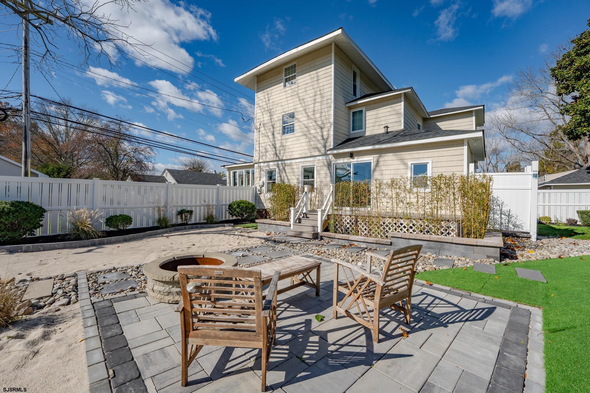 1203 West Mill Road Northfield, NJ 08225 - Photo 35 of 90 a view of a house with backyard and sitting area
