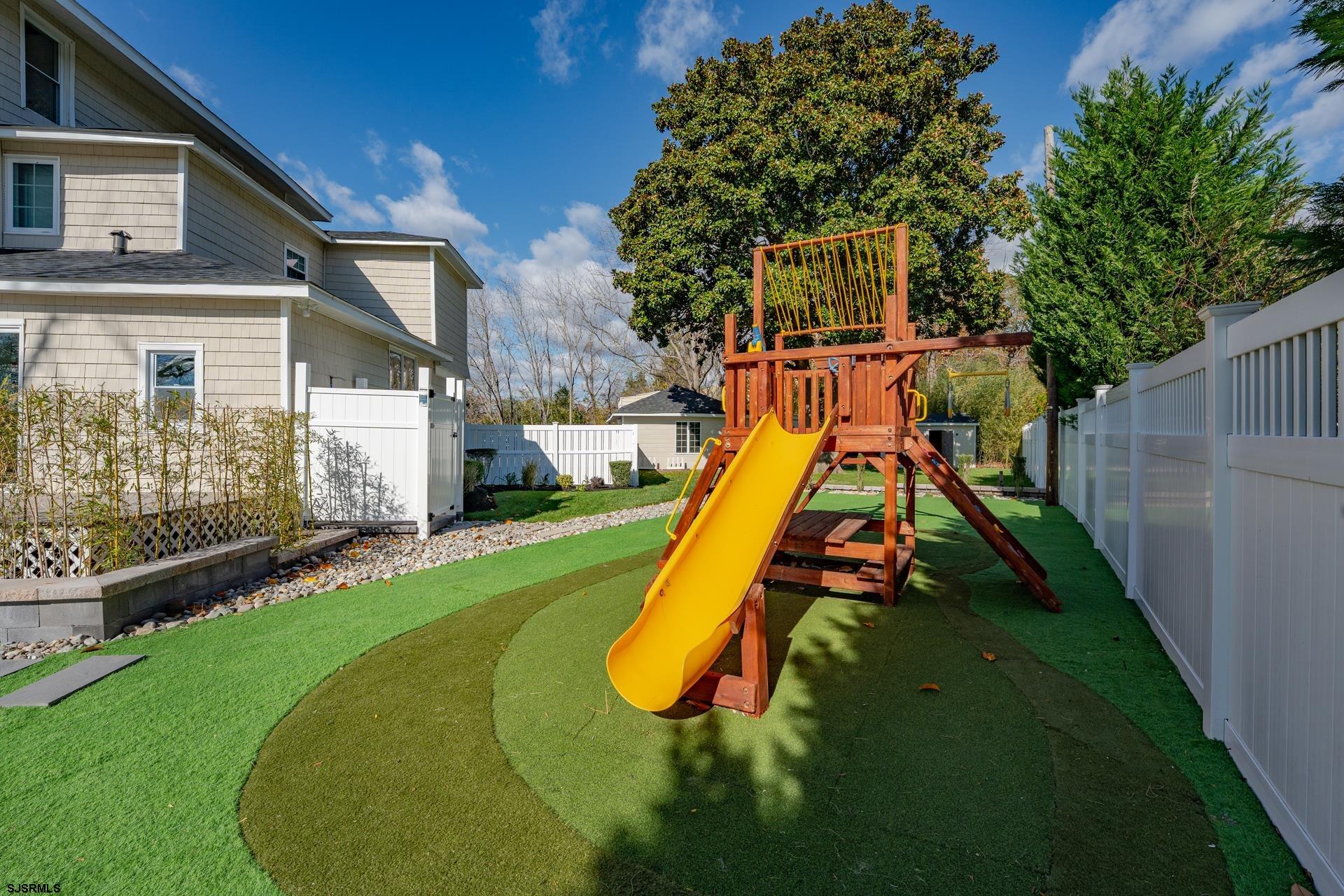 1203 West Mill Road Northfield, NJ 08225 - Photo 36 of 90 a view of a house with a slide