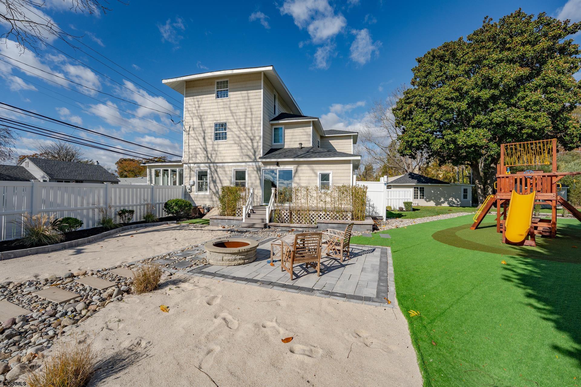 1203 West Mill Road Northfield, NJ 08225 - Photo 39 of 90 a view of a backyard with furniture and a fire pit
