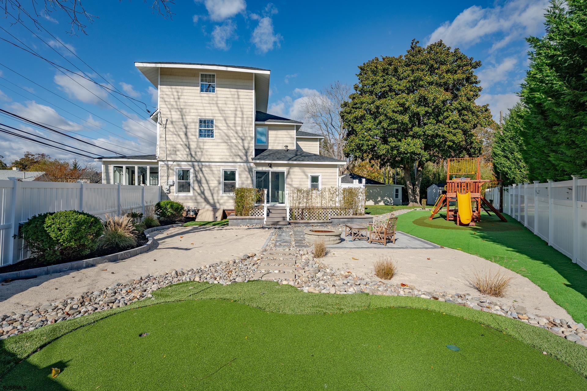 1203 West Mill Road Northfield, NJ 08225 - Photo 40 of 90 a view of a street with a house in the background