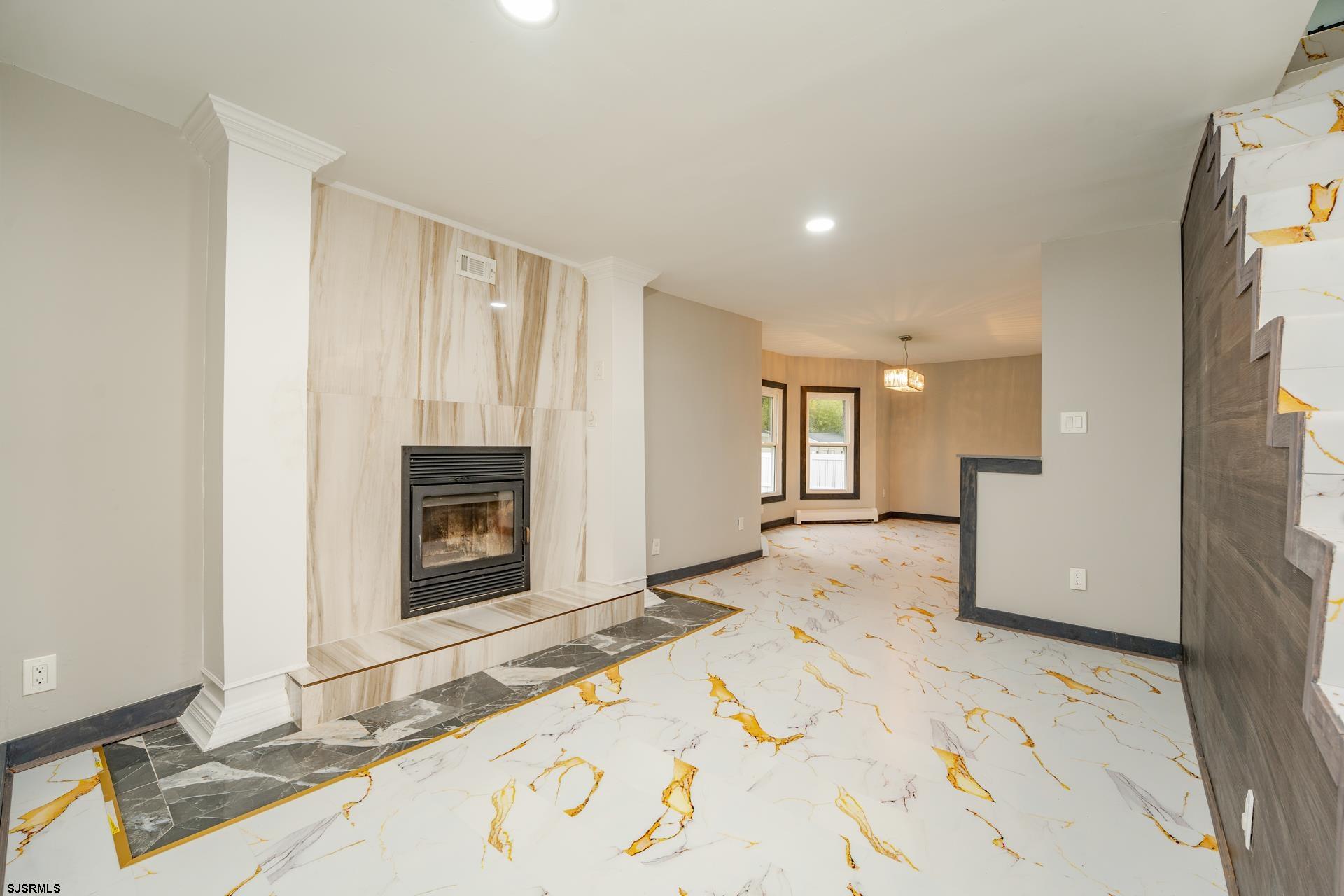 1203 West Mill Road Northfield, NJ 08225 - Photo 4 of 90 a view of a livingroom with a fireplace