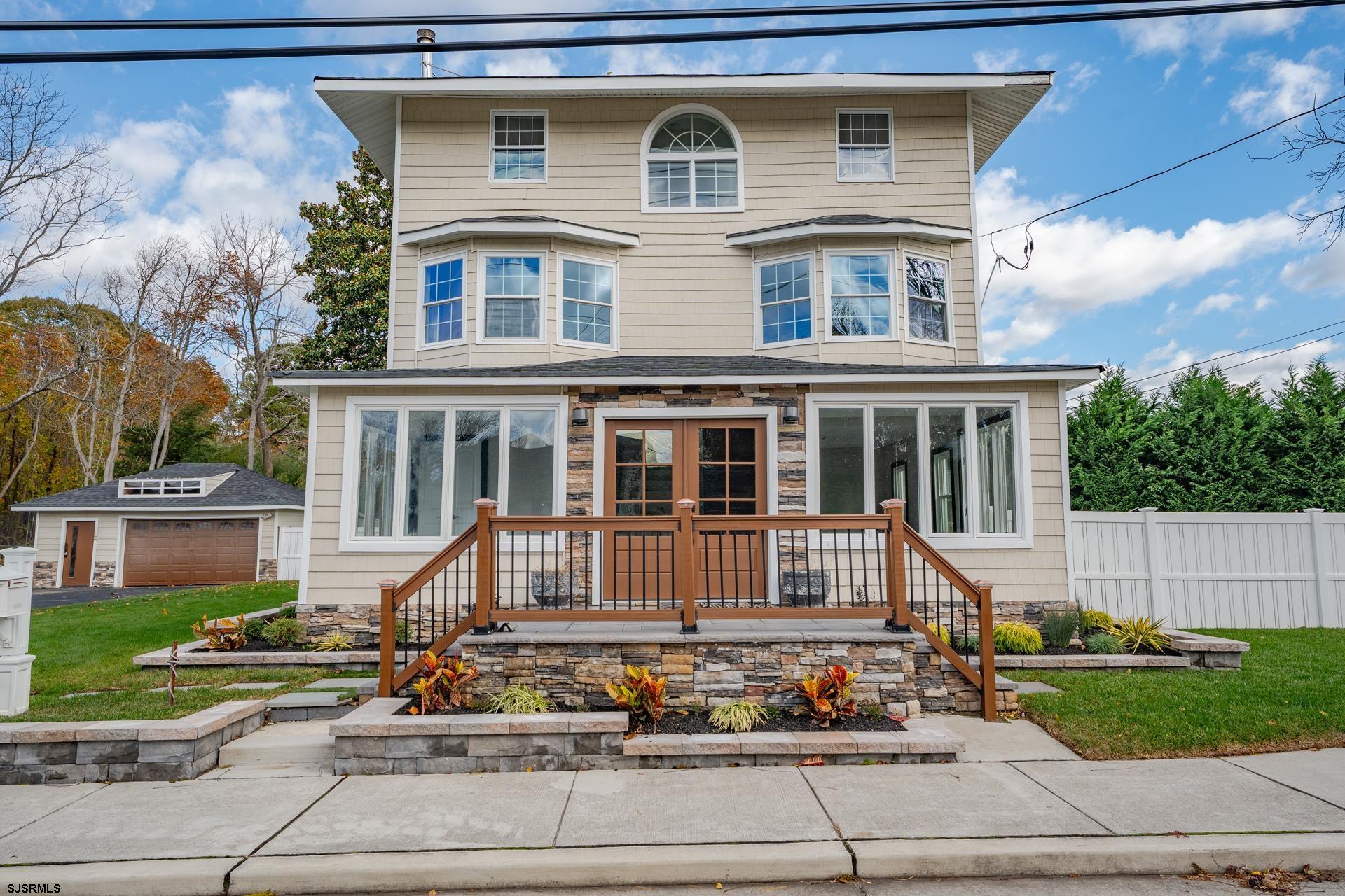 1203 West Mill Road Northfield, NJ 08225 - Photo 57 of 90 a front view of a house with a yard
