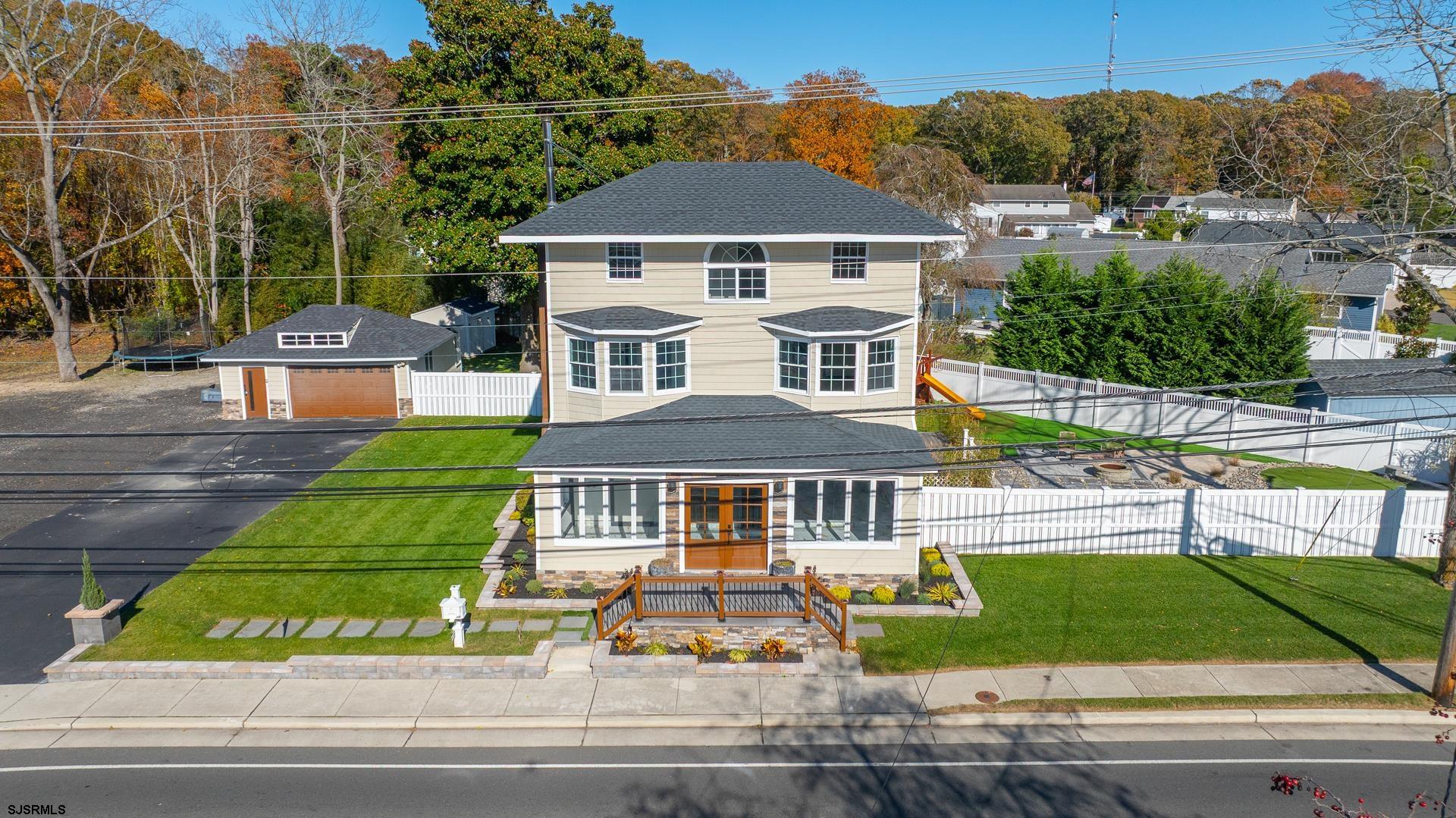 1203 West Mill Road Northfield, NJ 08225 - Photo 61 of 90 a front view of a house with a yard