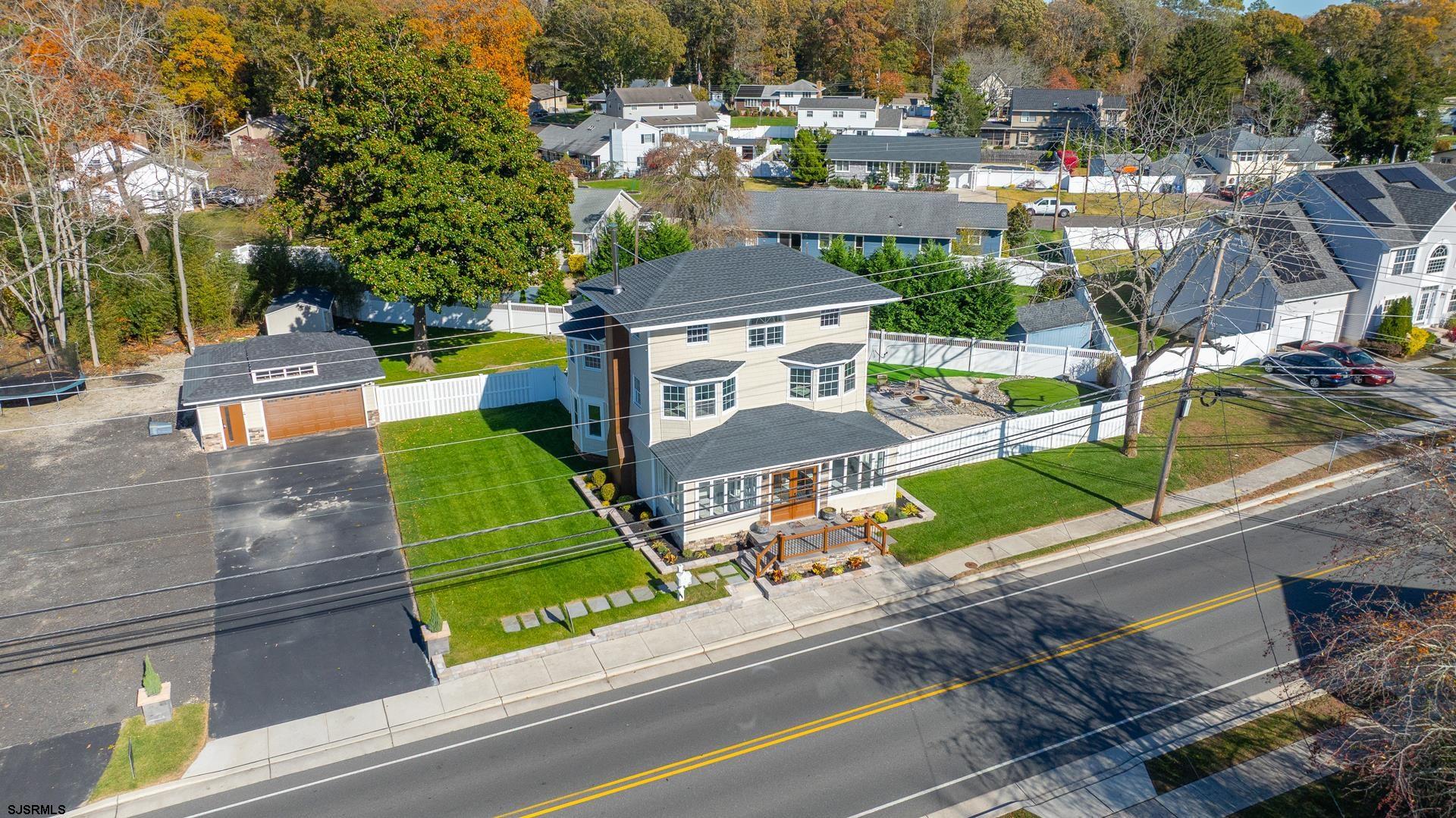 1203 West Mill Road Northfield, NJ 08225 - Photo 62 of 90 an aerial view of a house with a garden and trees
