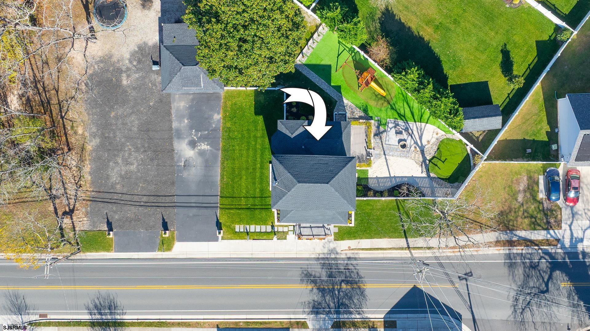 1203 West Mill Road Northfield, NJ 08225 - Photo 67 of 90 an aerial view of a house with a yard and potted plants