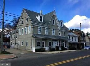 4-501 Main Street Church Hill, MD 21623 - Photo 1 of 7 a front view of a residential apartment building with a yard