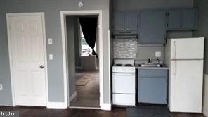4-501 Main Street Church Hill, MD 21623 - Photo 3 of 7 a kitchen with a refrigerator sink and cabinets