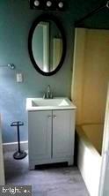 4-501 Main Street Church Hill, MD 21623 - Photo 7 of 7 a bathroom with a sink and a mirror