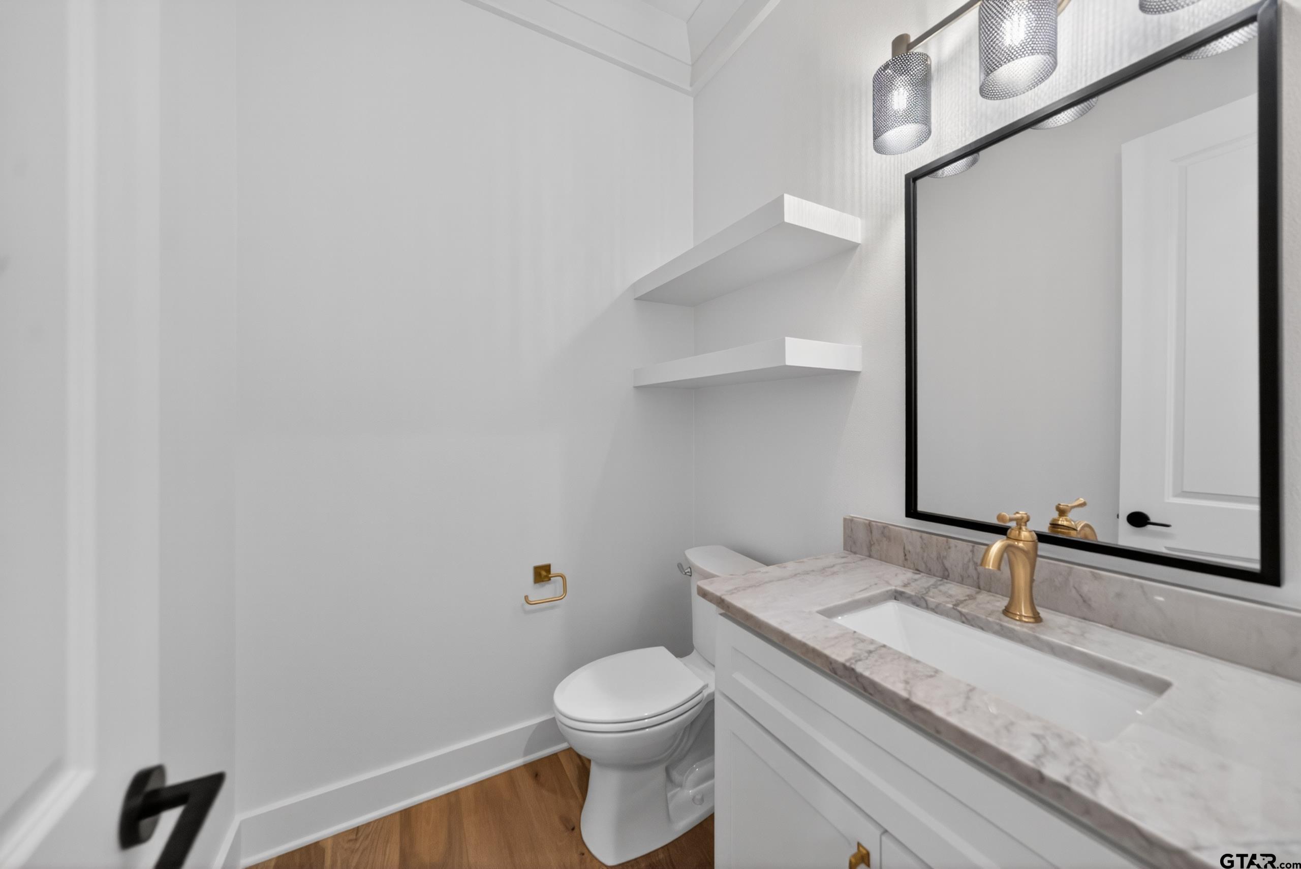 7517 Cross Gate Way Tyler, TX 75703 - Photo 43 of 47 a bathroom with a granite countertop toilet sink and mirror
