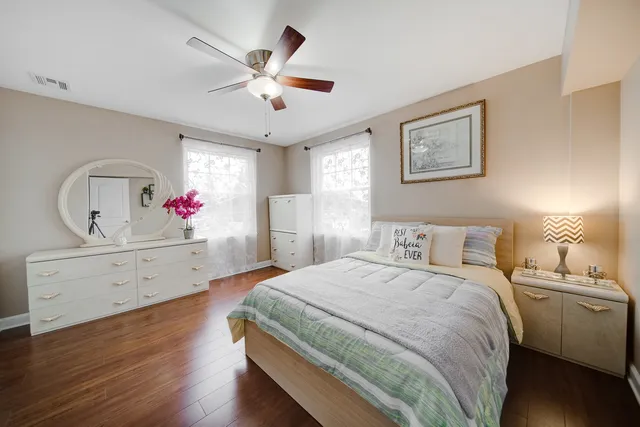 a bedroom with a bed and a dresser