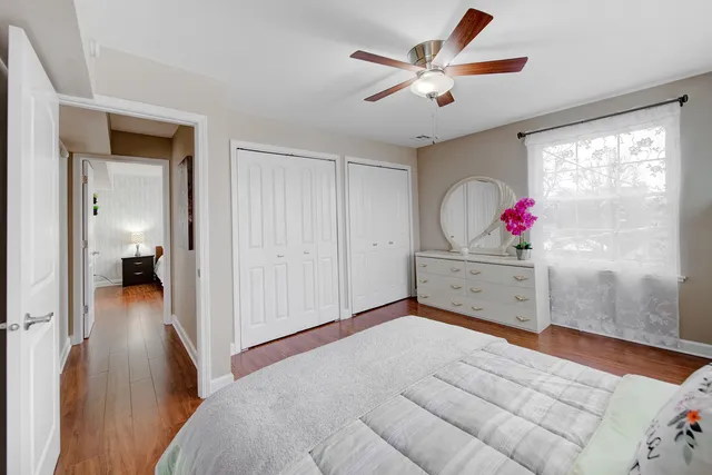 a view of a livingroom with wooden floor and cabinet