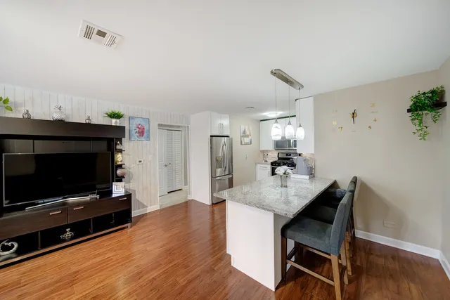 a kitchen with a table and chairs in it