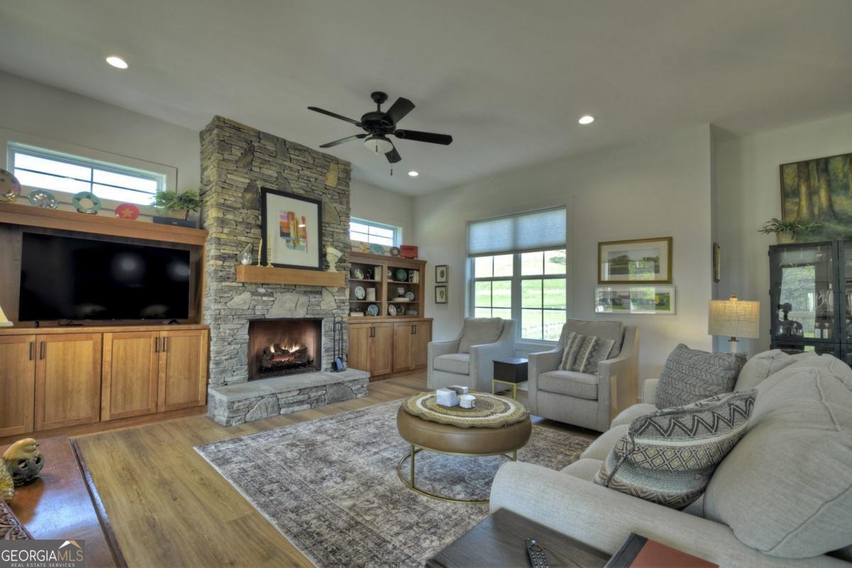 47 Downy Road, Unit 2 Blue Ridge, GA 30513 - Photo 37 of 95 a living room with furniture a flat screen tv and a fireplace