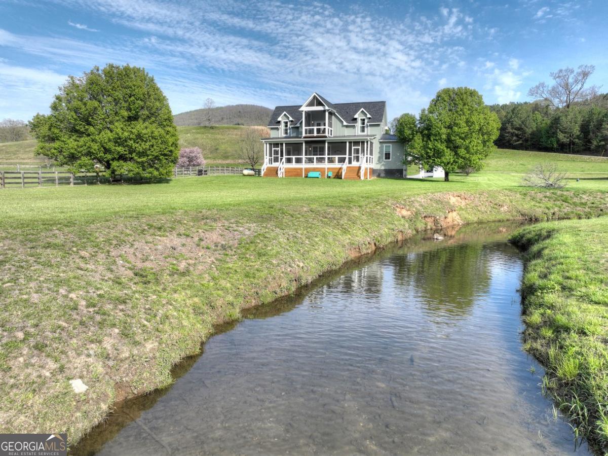 47 Downy Road, Unit 2 Blue Ridge, GA 30513 - Photo 51 of 95 a view of a lake with a building in the background