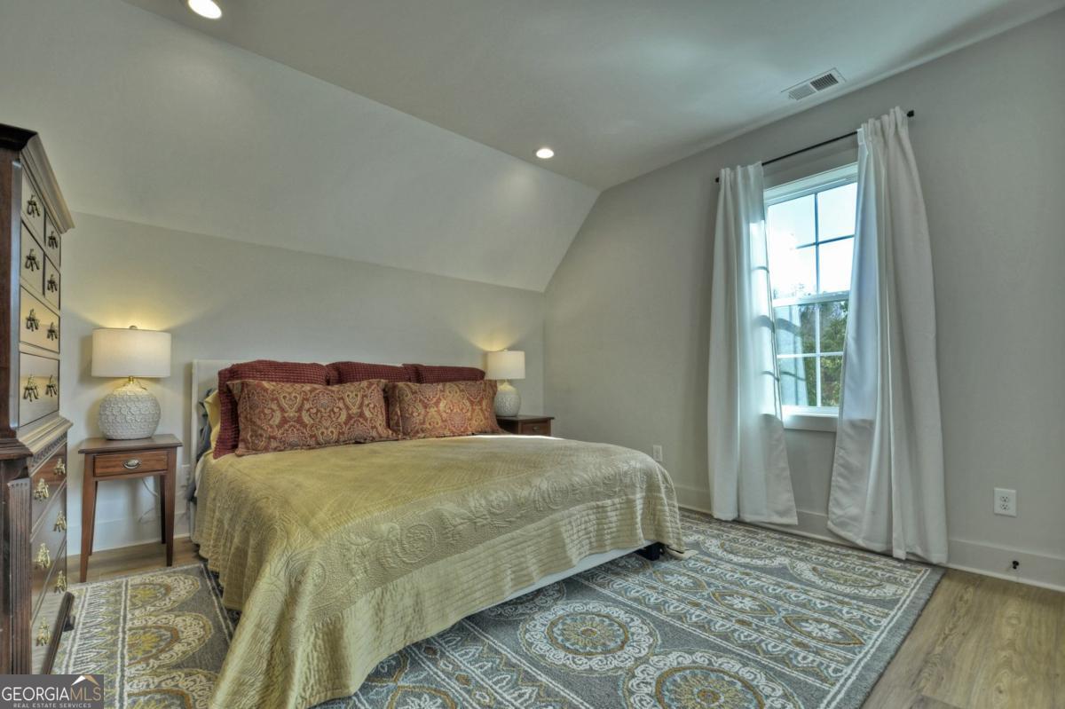 47 Downy Road, Unit 2 Blue Ridge, GA 30513 - Photo 57 of 95 a bedroom with a large bed and a window