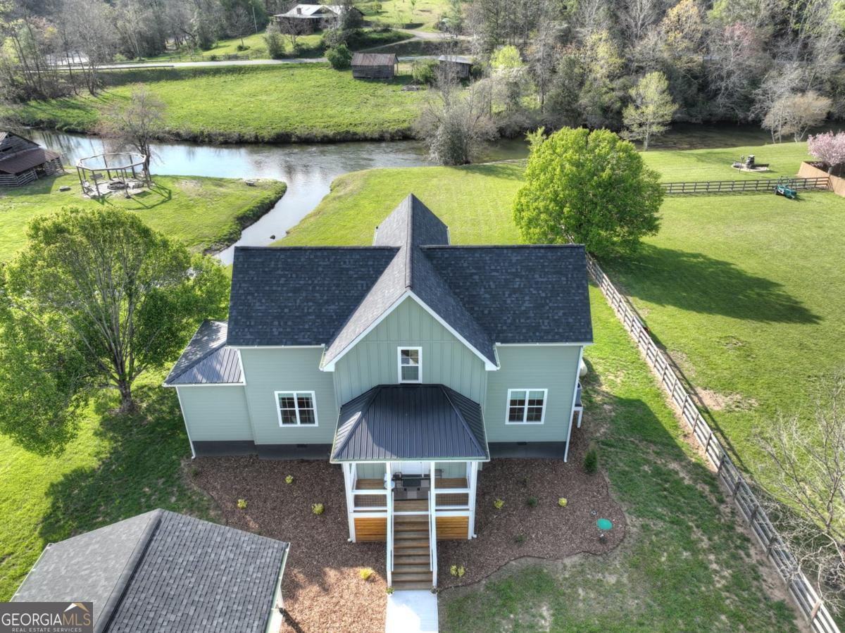 47 Downy Road, Unit 2 Blue Ridge, GA 30513 - Photo 69 of 95 a aerial view of a house with a yard and a large tree