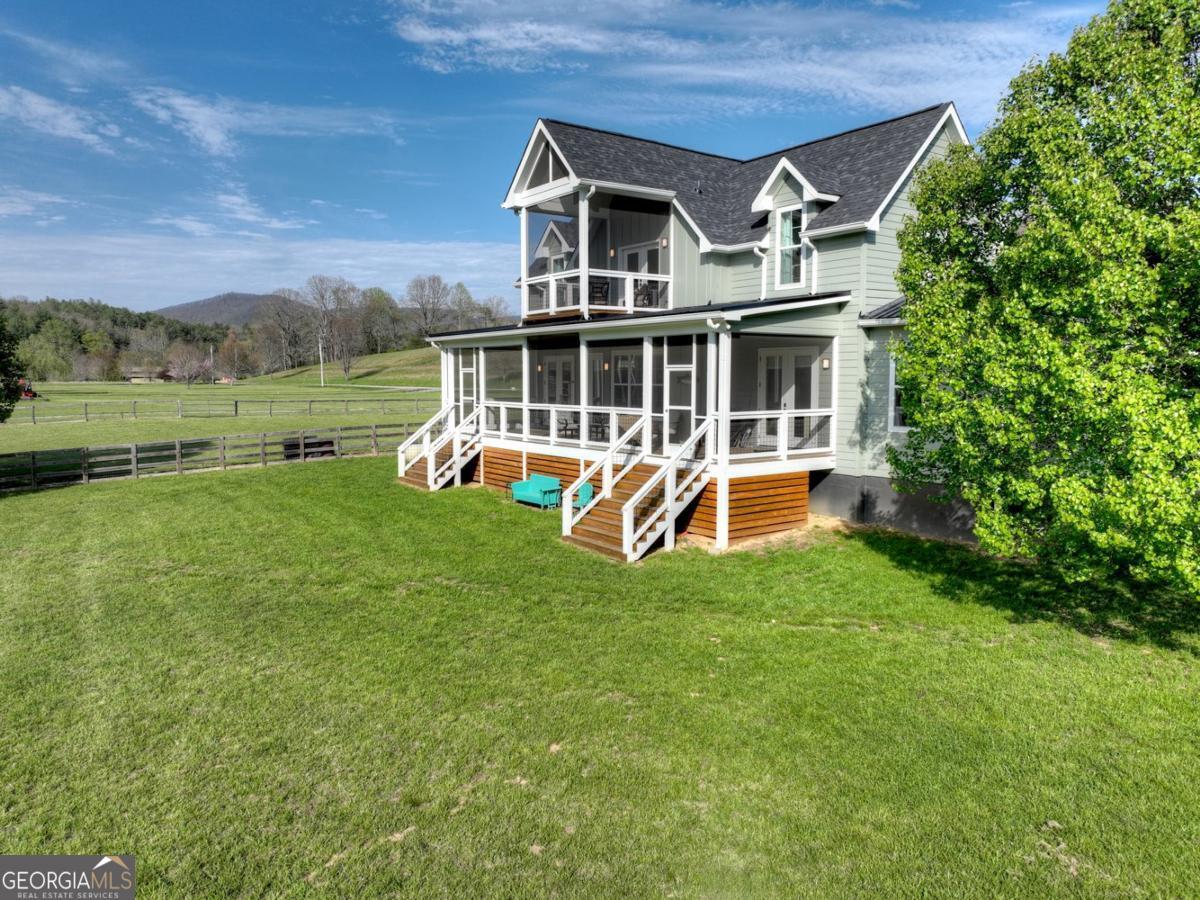 47 Downy Road, Unit 2 Blue Ridge, GA 30513 - Photo 77 of 95 an aerial view of a house with a big yard and large trees