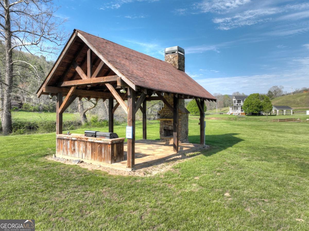 47 Downy Road, Unit 2 Blue Ridge, GA 30513 - Photo 88 of 95 a view of a house with backyard and a slide