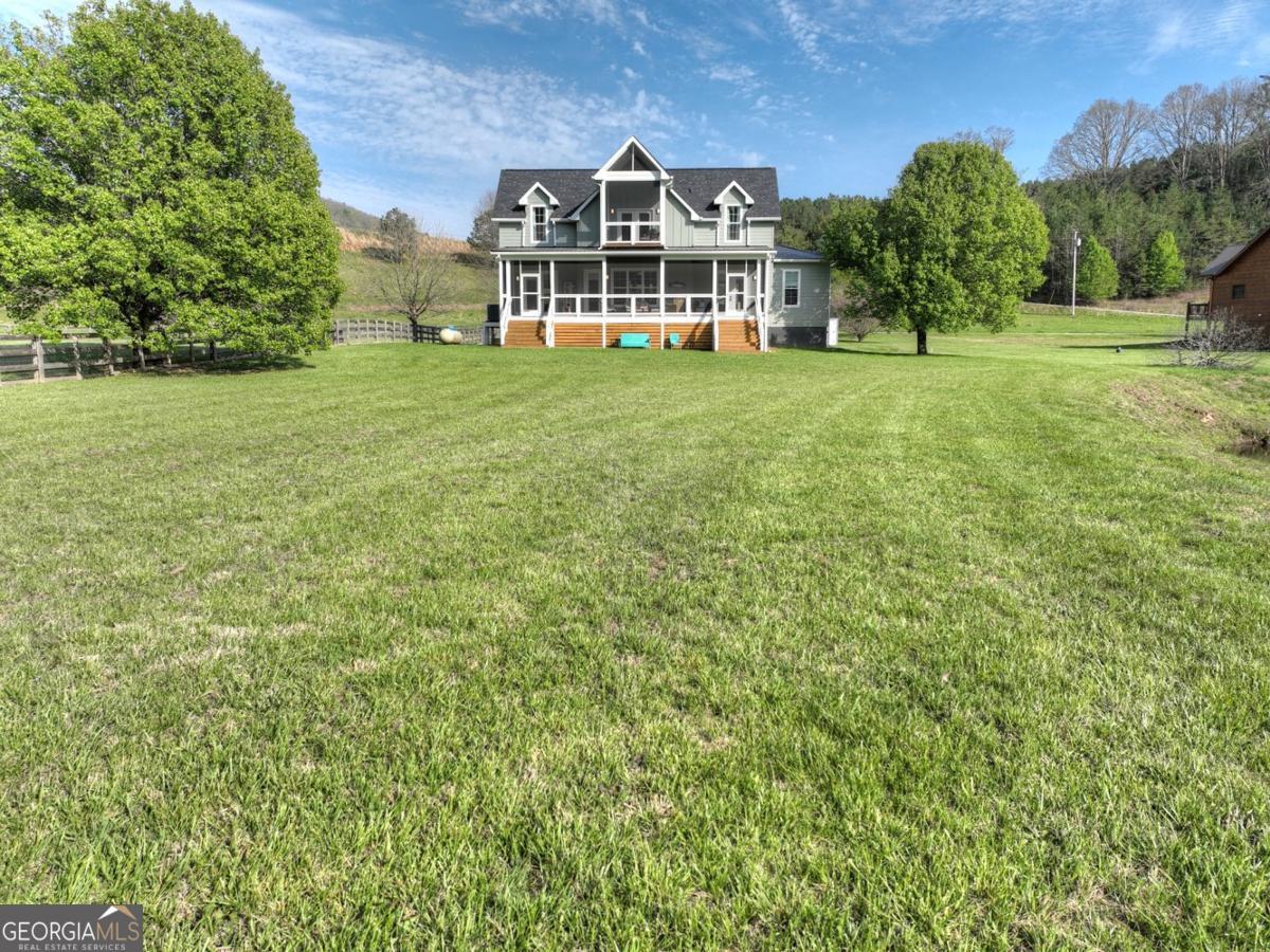 47 Downy Road, Unit 2 Blue Ridge, GA 30513 - Photo 92 of 95 a view of a house with a big yard and large trees