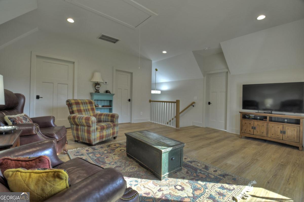 47 Downy Road, Unit 2 Blue Ridge, GA 30513 - Photo 94 of 95 a living room with furniture and a flat screen tv