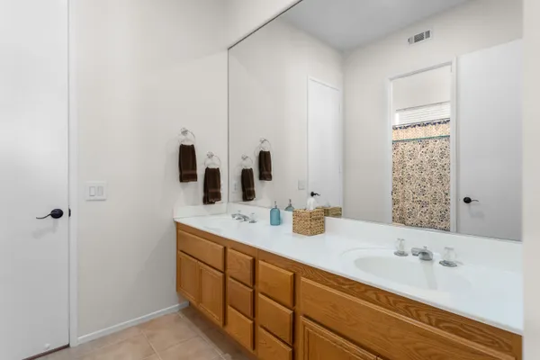 a en suite bathroom with a sink and mirror