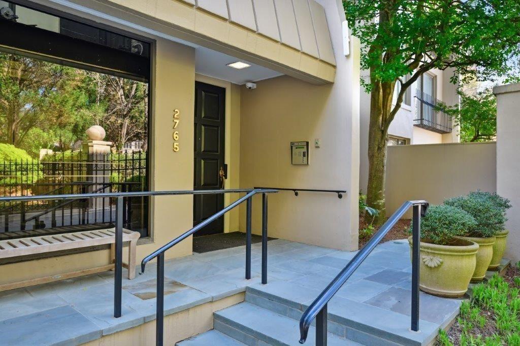 a view of balcony with two potted plants