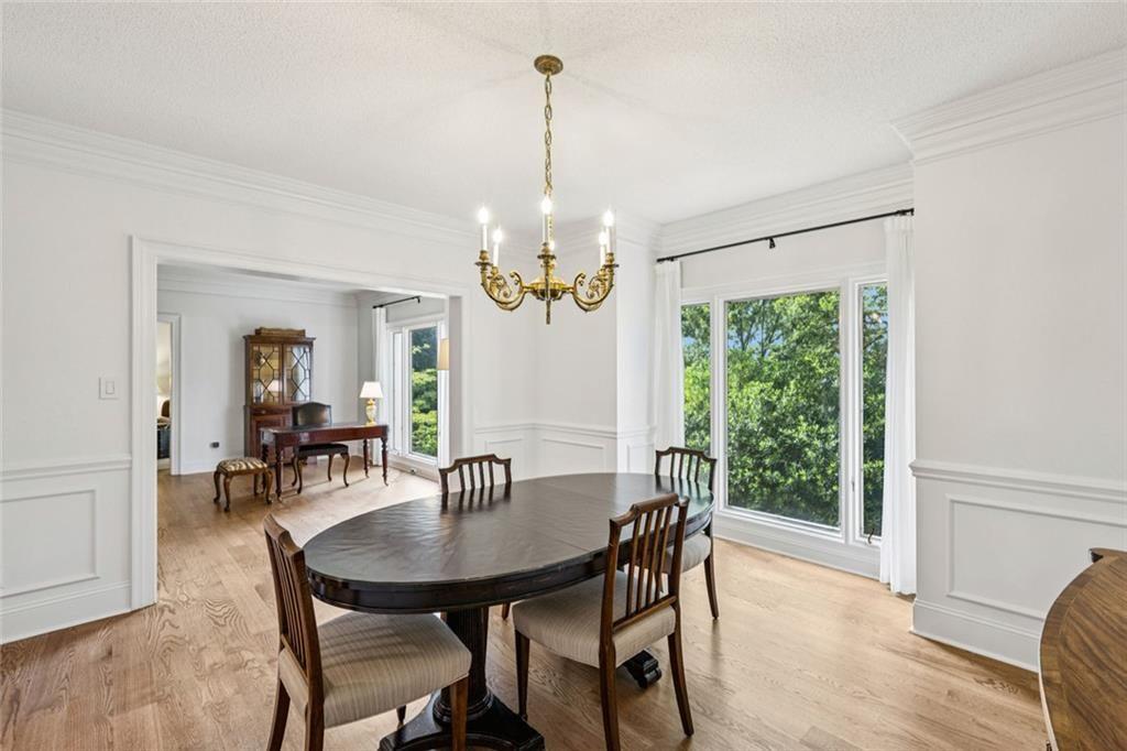 2765 Peachtree Road Northeast, Unit 3 Atlanta, GA 30305 - Photo 12 of 30 a view of a dining room with furniture window and outside view