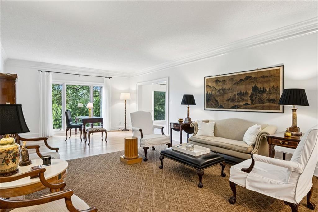 2765 Peachtree Road Northeast, Unit 3 Atlanta, GA 30305 - Photo 15 of 30 a living room with furniture and a flat screen tv