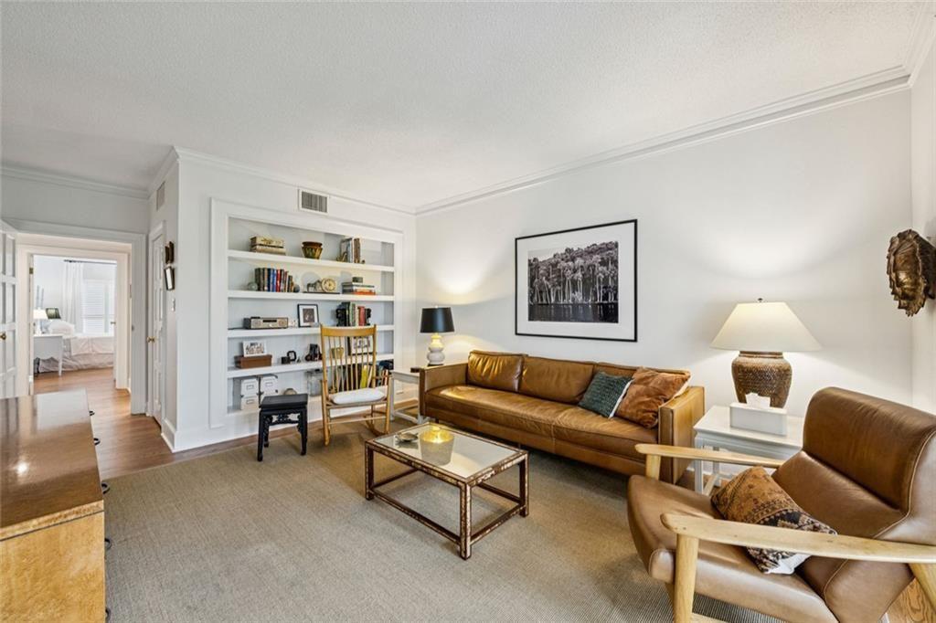 2765 Peachtree Road Northeast, Unit 3 Atlanta, GA 30305 - Photo 17 of 30 a living room with furniture a rug and a table