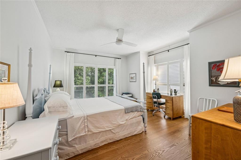 2765 Peachtree Road Northeast, Unit 3 Atlanta, GA 30305 - Photo 23 of 30 a bedroom with a bed and wooden floor