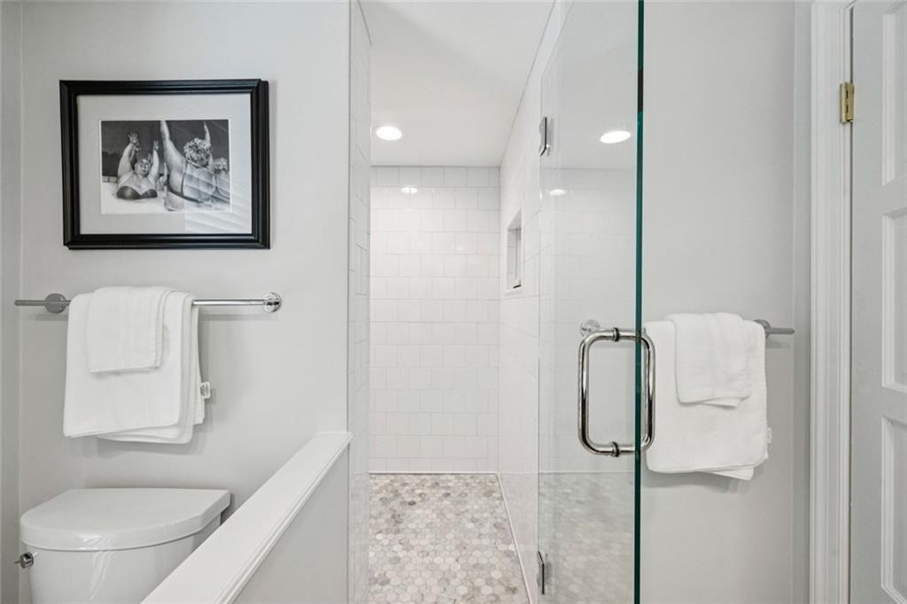 2765 Peachtree Road Northeast, Unit 3 Atlanta, GA 30305 - Photo 25 of 30 a bathroom with a shower and toilet