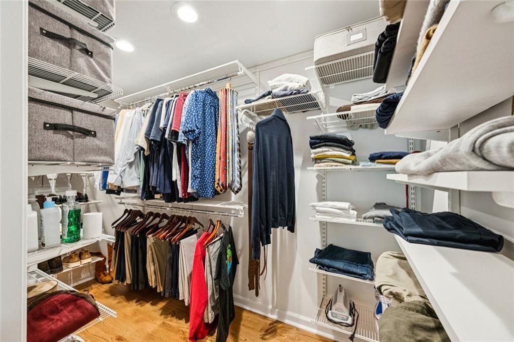 2765 Peachtree Road Northeast, Unit 3 Atlanta, GA 30305 - Photo 28 of 30 a view of walk in closet with clothes and shoes
