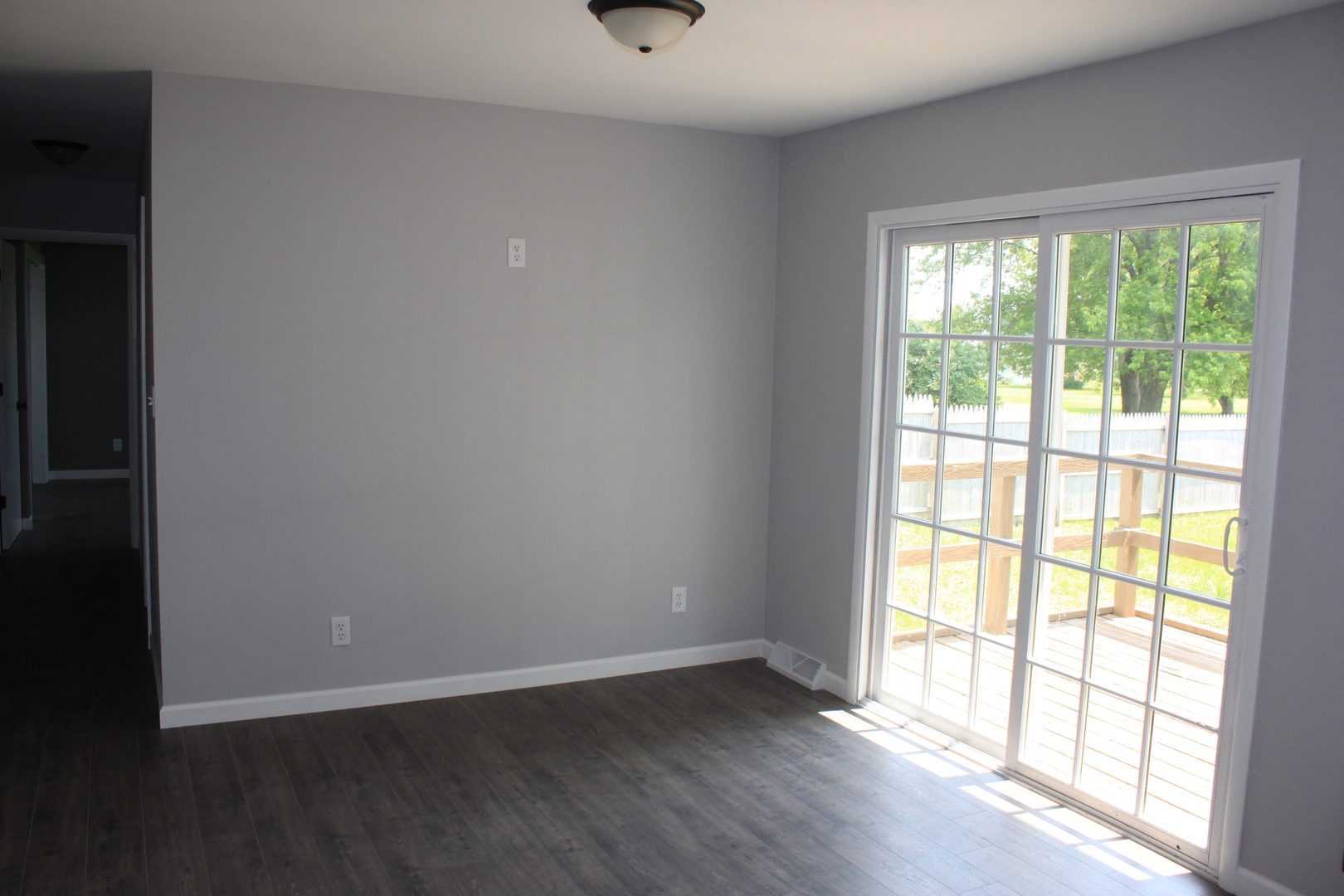 28931 Bell Road Rock Falls, IL 61071 - Photo 3 of 13 a view of an empty room with wooden floor and a window