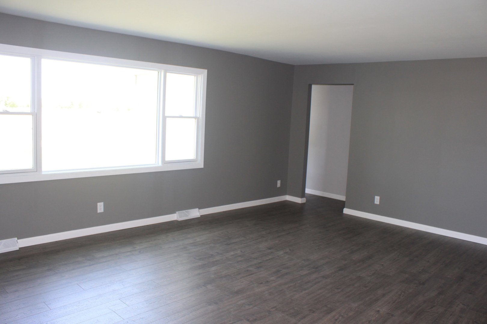 28931 Bell Road Rock Falls, IL 61071 - Photo 5 of 13 an empty room with wooden floor and windows