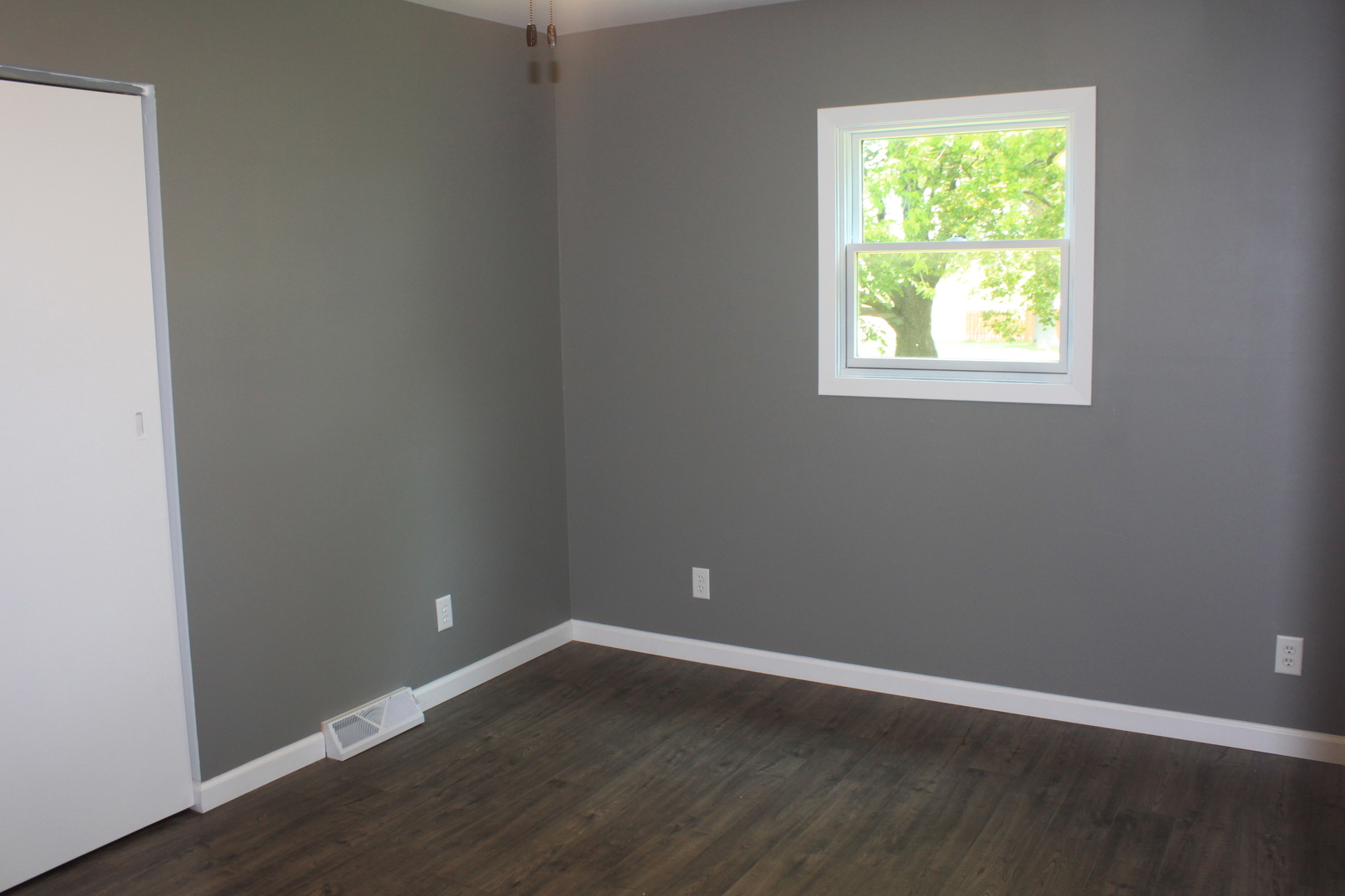 28931 Bell Road Rock Falls, IL 61071 - Photo 7 of 13 an empty room with wooden floor and windows