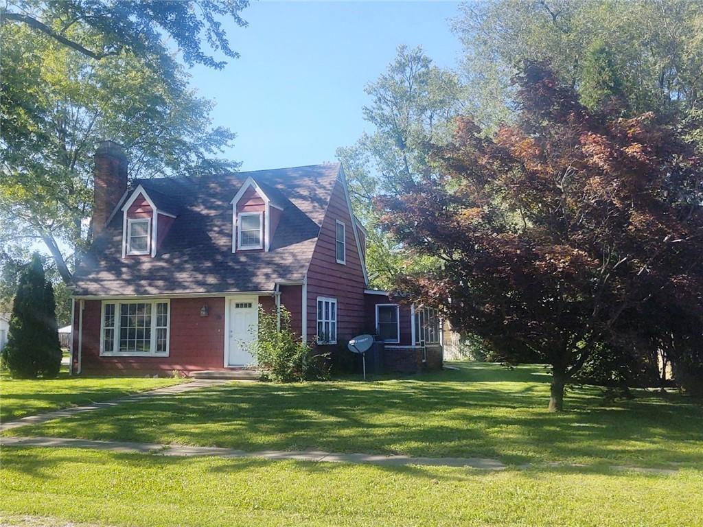 16 West George Street Sullivan, IL 61951 - Photo 1 of 1 a front view of a house with a garden