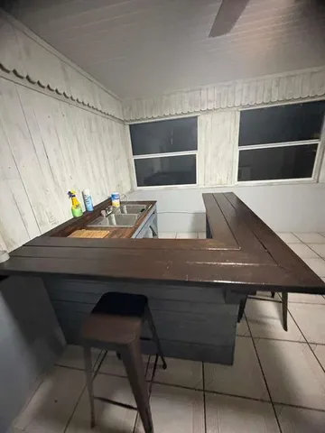 a view of dinning table and chairs in a room
