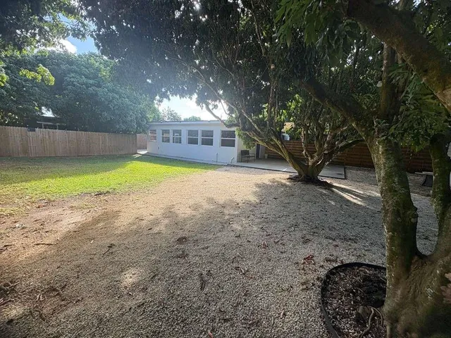 a view of outdoor space with playground and green space