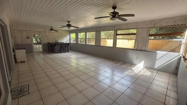 a view of a kitchen with a sink and cabinets