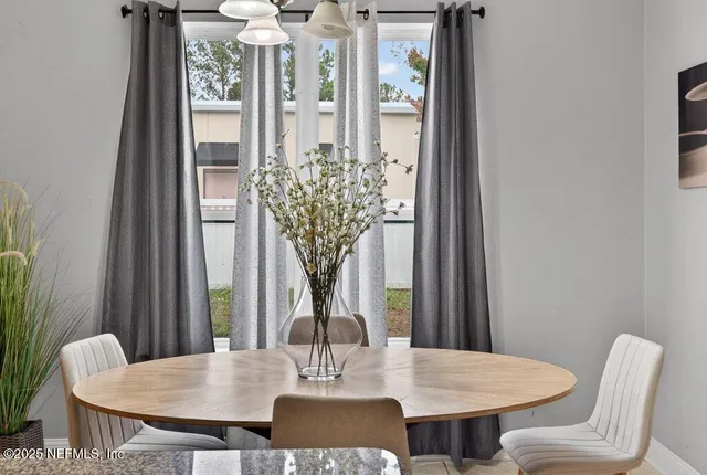 a kitchen with stainless steel appliances granite countertop a sink refrigerator and cabinets